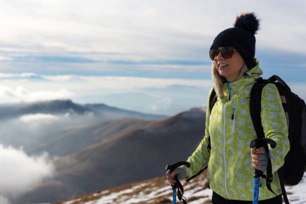 istock Female backpacker enjoys in view on the mountain 1132534721