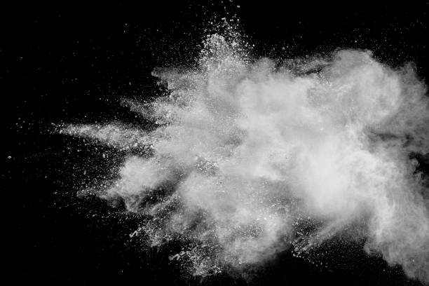 istock White powder explosion isolated on black background. White dust particles splash.Color Holi Festival. 1132535632