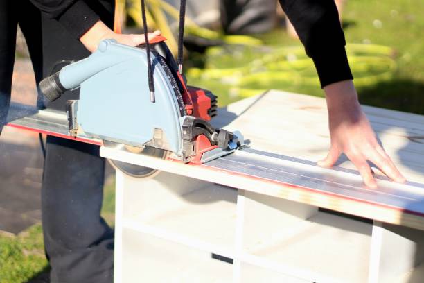 istock Woman using circular saw at home 1132536053