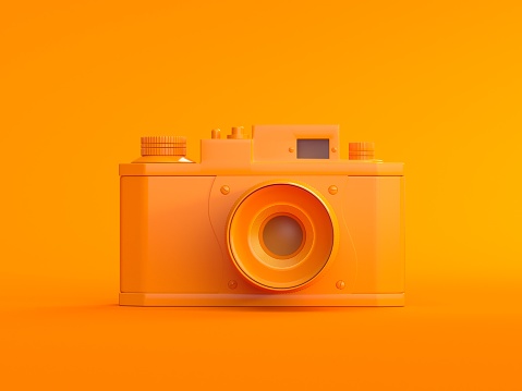3D Digital orange photo camera on orange background