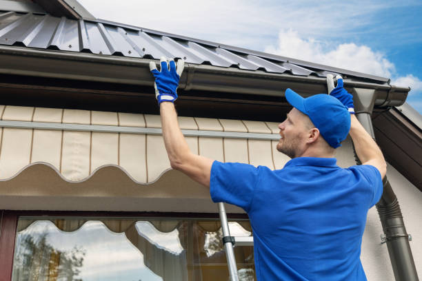 man installing house roof rain gutter system man installing house roof rain gutter system roof gutter photos stock pictures, royalty-free photos & images