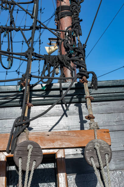 istock Stacked and well-folded ropes on the deck of a sailing ship. Accessories needed for sailing. Season of the spring. 1132537540