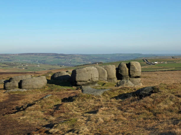 istock rock formations in bridestones moor in west yorkshire with a panoramic view over pennine countryside 1132539217