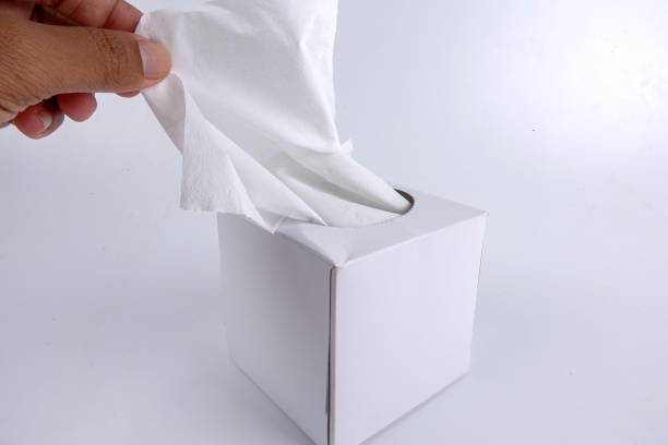 istock Cropped Hand Holding Facial Tissue On White Background 1132540261