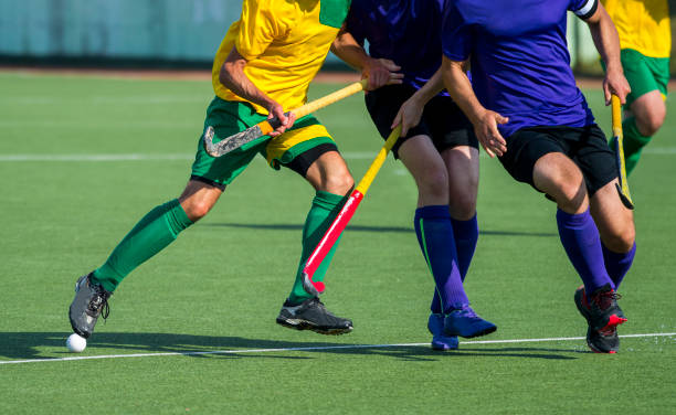 istock Low Section Of Men Playing Hockey On Turf 1132540320