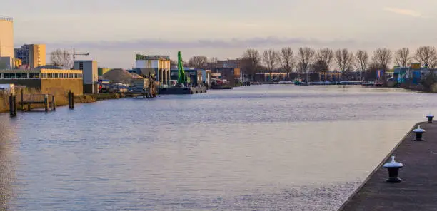 Photo of Industrial zone at the water side of Alphen aan den Rijn, The Netherlands, city scenery of a well known dutch city