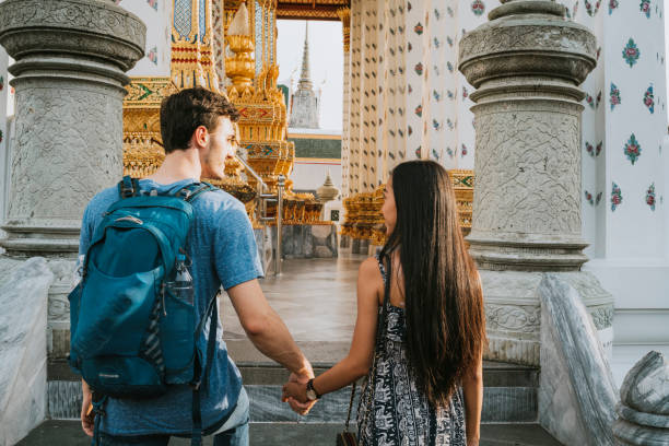 istock Young couple exploring a temple in Bangkok 1132541570