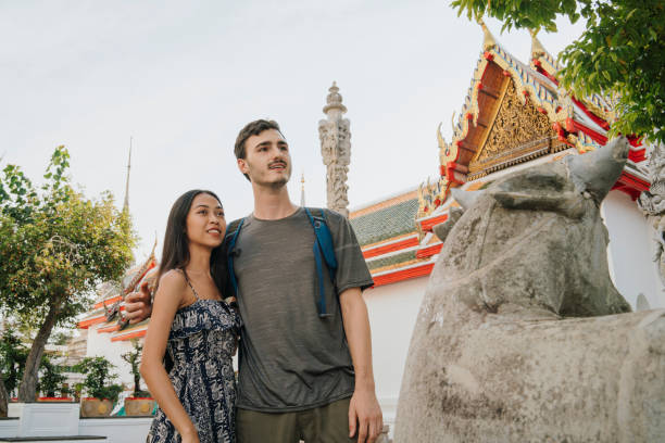istock Young couple exploring a temple in Bangkok 1132541573