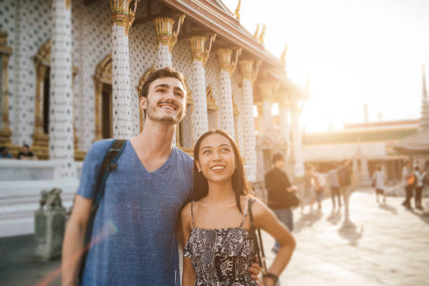Young couple exploring a temple in Bangkok