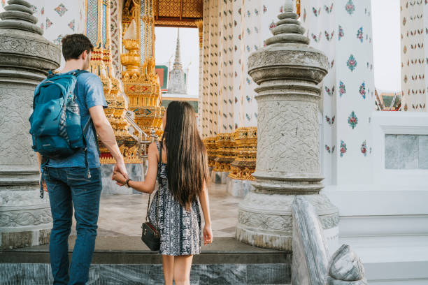 istock Young couple exploring a temple in Bangkok 1132541577