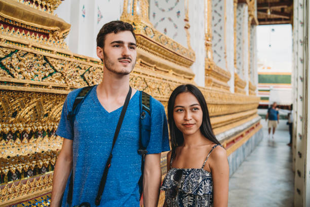 istock Young couple exploring a temple in Bangkok 1132541581