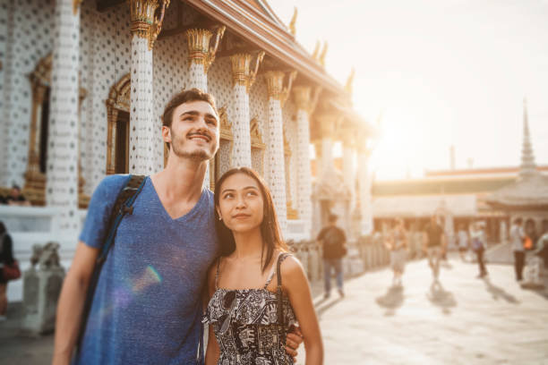 istock Young couple exploring a temple in Bangkok 1132541584