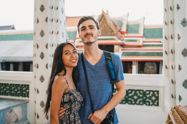 istock Young couple exploring a temple in Bangkok 1132541589