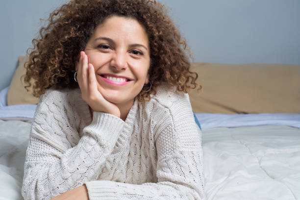 istock Young woman lying on the bed 1132542077