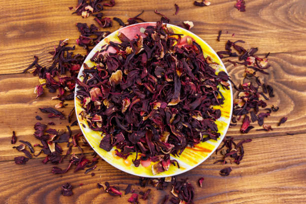 istock Dried hibiscus (carcade, roselle) on wooden table 1132542634