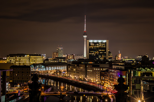 Berlin skyline at night with cars and buildings