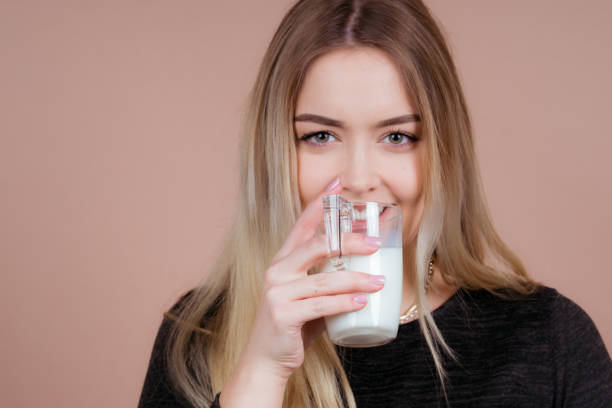 istock cute girl drinks milk 1132545243