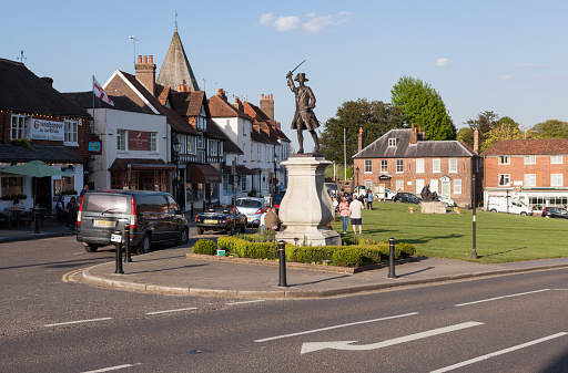 The Market Square in Woodbridge, Suffolk, Eastern England, where the weekly Thursday food and produce market is held. To the right is the Victorian Gothic style town water pump house, constructed in 1876. Woodbridge has many old buildings and is an attractive town beside the River Deben.