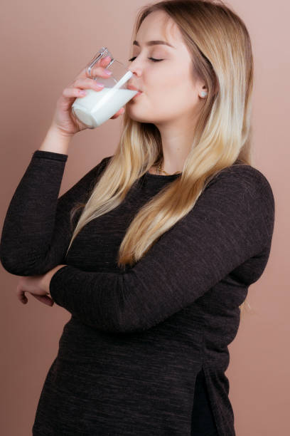 istock cute girl drinks milk 1132545959