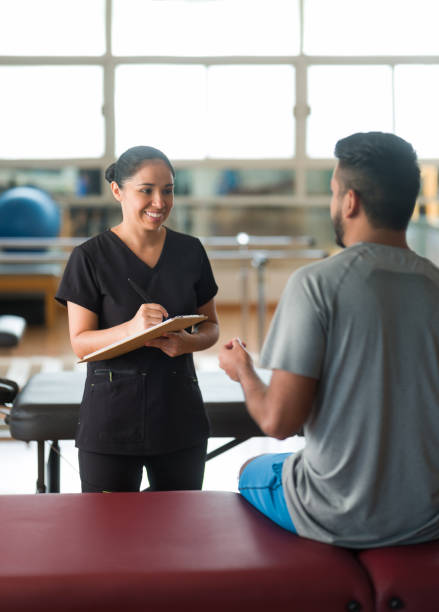 istock Male patient explaining condition during medical consultation 1132546396