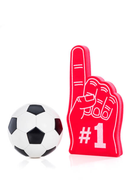 istock A black & white soccer ball with a red #1 foam hand against white background 1132549236