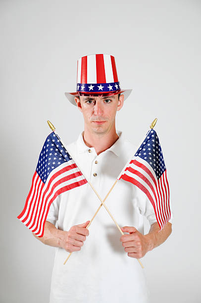 istock Patriotic Man Holding Two American Flags 113255062