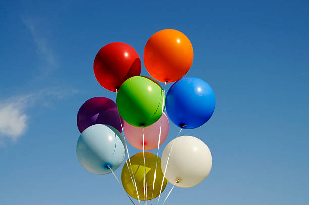 istock Group of Colorful Balloons Against a Blue Sky 113255164
