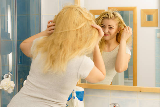 istock Female having problem with blonde hair 1132554675