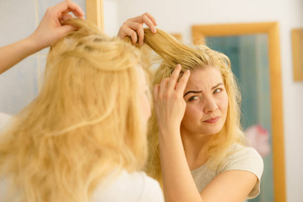 istock Female having problem with blonde hair 1132555837