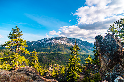 Evening Sunset Mountain View across pristine Wilderness of Lake Tahoe California as clouds move in and the landscape turns into a magical wonderland