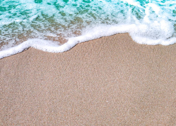 istock Soft wave of blue ocean on sandy beach. Background. 1132559208