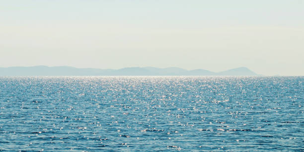 istock Sea and mountain range. Summer seascape horizon. 1132560893