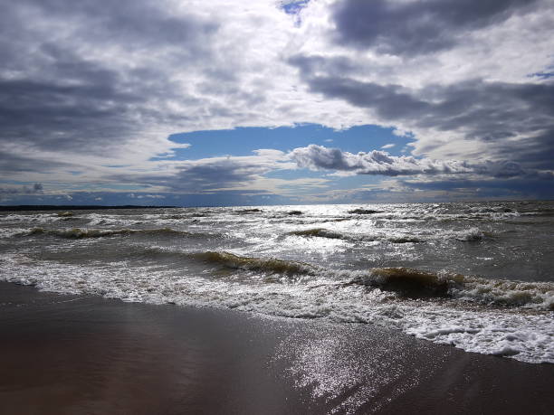 istock Big waves on the beach in cloudy weather 1132563438