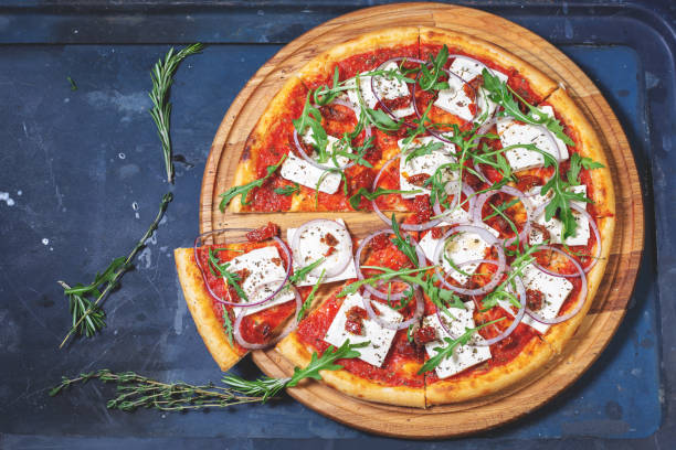istock pizza with tofu and arugula 1132566637