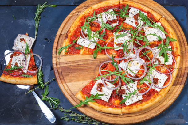 istock pizza with tofu and arugula 1132566646