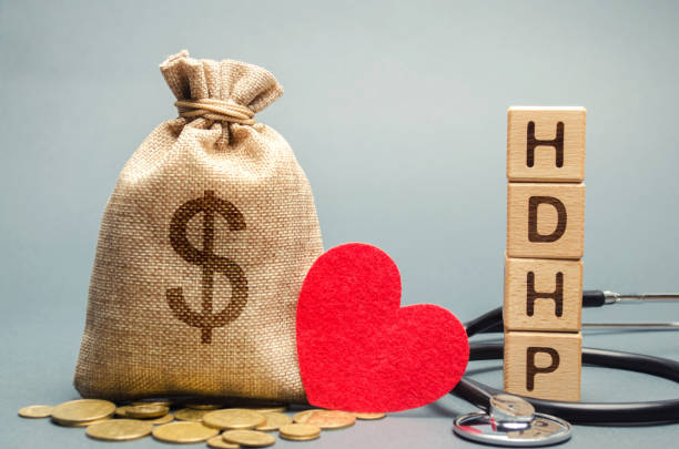 Wooden blocks with the word HDHP and money bag with dollar sign. High-deductible health plan concept. Health insurance plan with lower premiums and higher deductibles than a traditional health plan Wooden blocks with the word HDHP and money bag with dollar sign. High-deductible health plan concept. Health insurance plan with lower premiums and higher deductibles than a traditional health plan free syrian army stock pictures, royalty-free photos & images