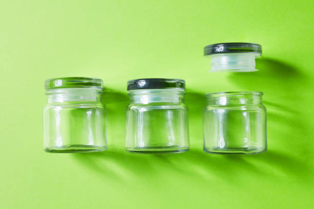 istock Glass containers on green background, from above 1132575872