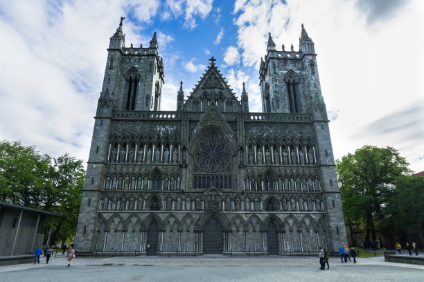 Finely decorated Gothic facade of Nidaros Cathedral (Nidaros Domkirke), the most famous landmark of Trondheim, Norway Finely decorated Gothic facade of Nidaros Cathedral (Nidaros Domkirke), the most famous landmark of Trondheim. Trondheim, Norway, August 2018 finely stock pictures, royalty-free photos & images