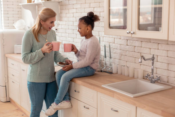 Mother and daughter enjoying weekend spending morning together