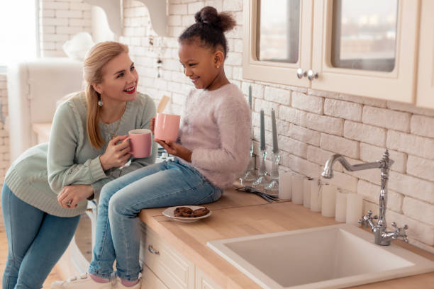 istock Loving mother feeling happy looking at her adopted daughter 1132579618