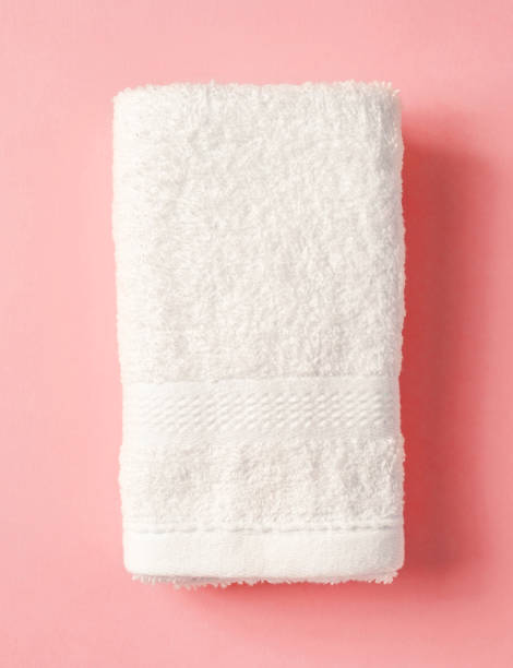 istock White spa towel on pink,from above 1132582479