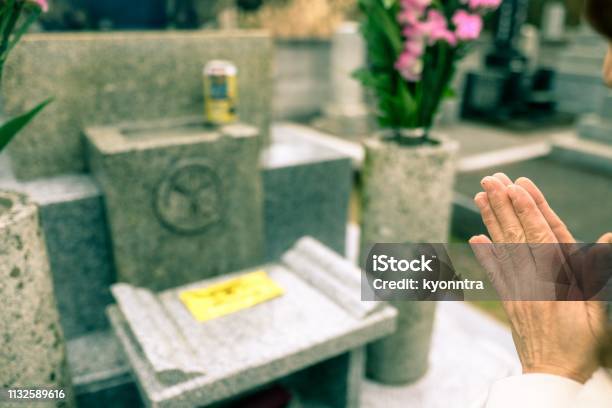 Praying For Ancestors Grave Stock Photo - Download Image Now - Funeral, Tomb, Japanese Ethnicity