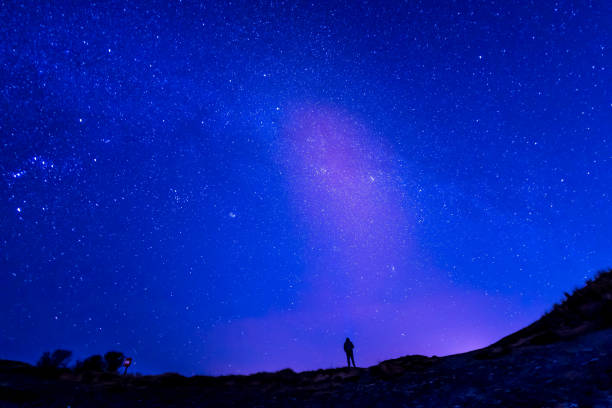 istock Senior Caucasian man starry sky background 1132599229