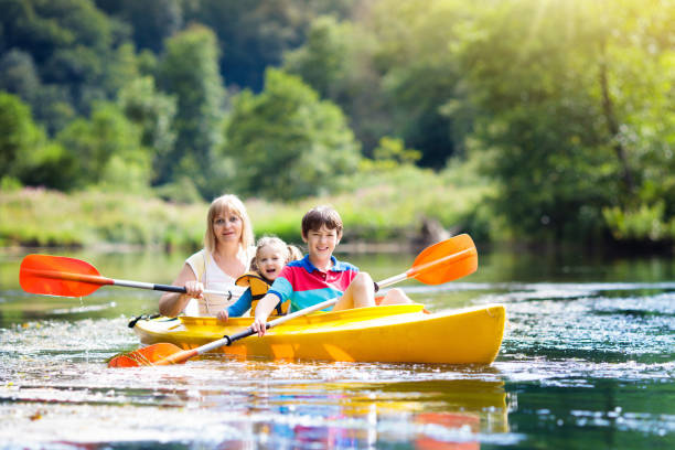 istock Child on kayak. Kids on canoe. Summer camping. 1132605377