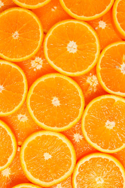 istock Slices of oranges as a background, top view. 1132607243