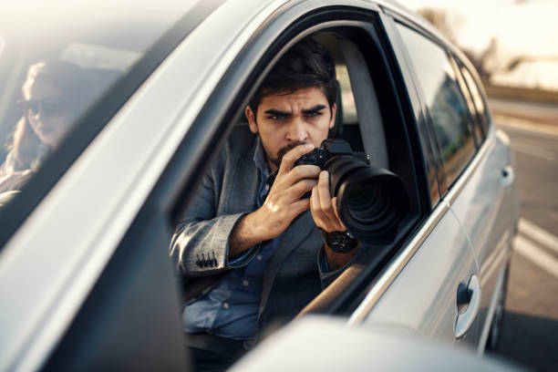 istock Close-up - Young Man Photorapher Sitting In The Car 1132608563