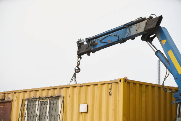 istock Crane truck unloading portable workers house container booth 1132609056