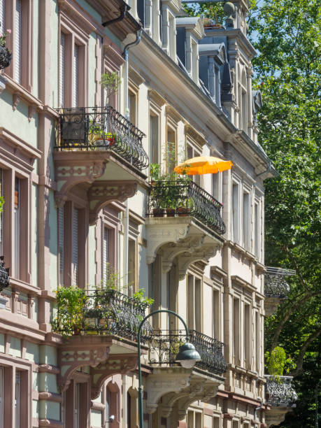 Facade of historic building with sunshade on balcony.