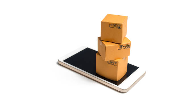istock A stack of boxes on a smartphone. Online shopping concept. Shopping through the mobile app. Goods and services, e-commerce. Online retail. Marketing. Non-cash and contactless payment by phone. 1132614938