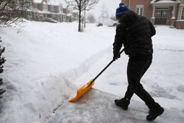 istock Man shoveling snow during snow storm in Toronto 1132615904